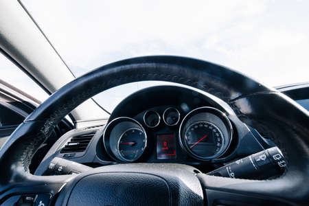 Speed background. Car dashboard panel with speedometer, tachometer. Fast vehicle, no limit conceptの写真素材