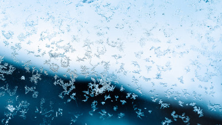 Frosting macro. Cold snow winter background. Blue crystal frozen abstract pattern. White frost ice...