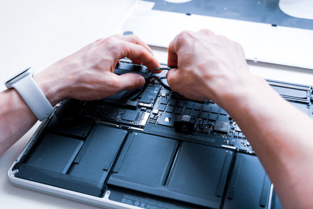 Pc repair. Maintenance engineer support. Computer technician service with laptop on hardware technology background. Developer soldering electronic componentのeditorial素材