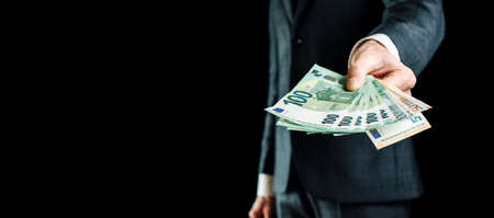 Euro money. Rich businessman holding Europe money. Cash Euro bill backgroundの写真素材