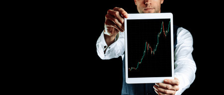 Price chart. Investment business technology app on digital screen in businessman hands. Finance...