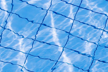 Water pool background. Blue wave pool texture, clear water surface. Abstract summer sea patternの写真素材