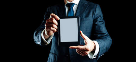 Ebook template. Digital book, library reader tablet in business man hand. Online learning, home school conceptの写真素材