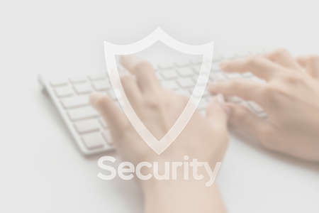Hack security data protection. Computer Internet safe symbol on blured keyboard background. Business, technology, internet and networking security conceptの写真素材