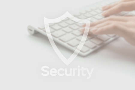 Internet security computer data symbol on blured keyboard background. Hacker attack and data breach, information leak conceptの写真素材