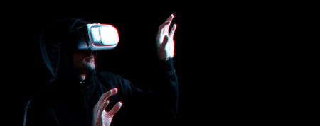Vr goggles virtual reality blurred. Young man in digital helmet for 3d virtual reality game on dark...