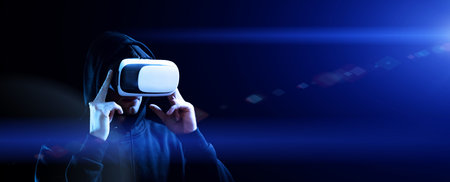 VR goggles virtual reality. Young man in digital helmet for 3d virtual reality game on dark...