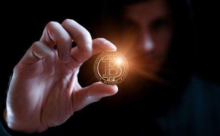 Crypto money bitcoin background. Crypto hacker hand hold golden BTC bit coin. Digital money, stock...