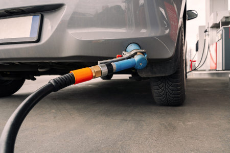 fuel car. Pump petrol from nozzle in vehicle tank. Gasoline, oil gas station. Economy business with...