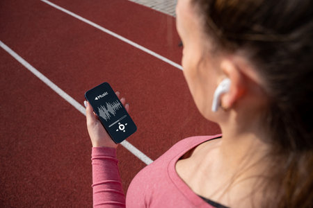 fitness training music. Girl choose music for running. Lifestyle workout exercise woman training....