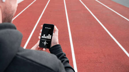 training music. Lifestyle workout exercise man training. Young beautiful man doing sports. Sport music and healthy lifestyleの写真素材