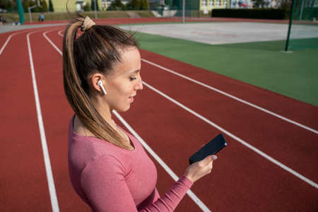 Workout music. running in the park. Sport lifestyle workout exercise woman training. Fitness, sport...