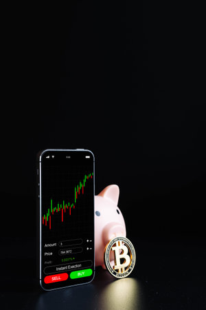 Cryptocurrency trading. Pink piggy bank, gold crypto currency BTC bitcoin, bitcoin wallet mobile...