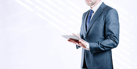 businessman using tablet. Young business man analyzing growth graph chart and data sales. digital...