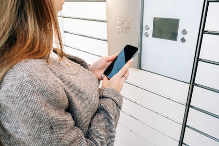post locker. Delivery automat terminal and hands with parcel courier box. Parcel delivery, pickup...