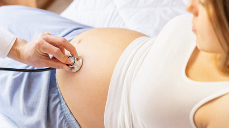 Pregnant consult doctor. Medical clinic for pregnancy consultant. Doctor examining pregnancy woman...