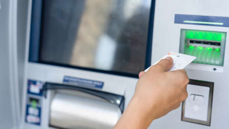 Atm machine money cash. woman withdraw money bill. holding american hundred dollar cash. bank credit card and dollar billの写真素材