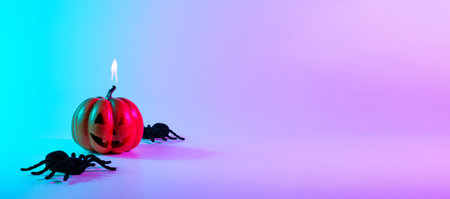 Halloween spider. Scary spooky pumpkin, black night spider on night neon helloween background. Happy Halloween concept. frame. copy spaceの写真素材