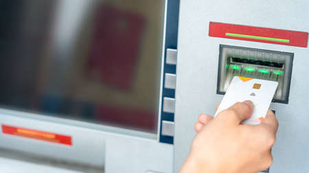 Atm money machine cash. Money bank credit card holding hand. Withdraw cash from atm. bank credit card, us dollarの写真素材