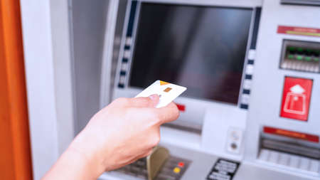 Atm cash machine. Money bank credit card holding hand. Withdraw cash from atm. Money dollar, bank credit cardの写真素材