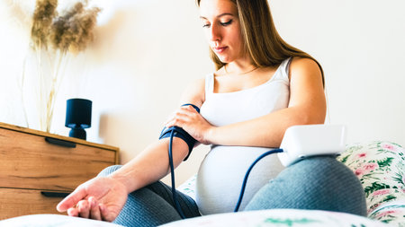 blood pressure pregnant woman test. Pregnancy mother with blood test sphygmomanometer check pressure. Pregnancy, medical health care conceptの写真素材