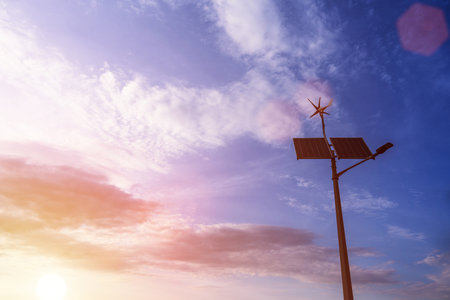 alternative energy concept. Wind turbine with solar energy power panel, renewable photovoltaic technology. Renewable energy sources conceptの写真素材