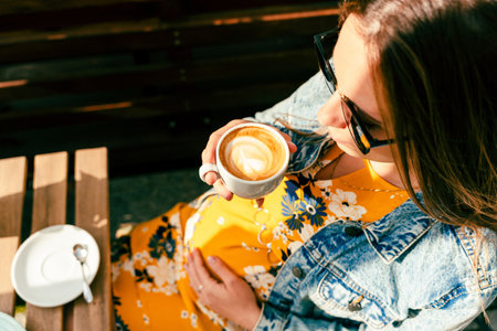 Woman coffee cafe pregnancy drink. Lifestyle morning with happy pregnant girl drink espresso coffee. Concept for coffee product advertisingの写真素材