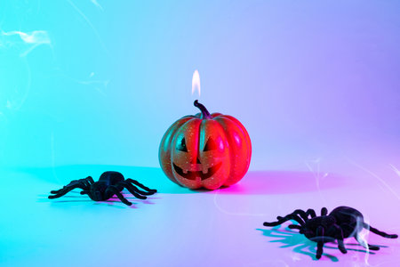 Halloween party. Black night spider, scary spooky pumpkin on night neon halloween background. Happy Halloween concept. frame. copy spaceの写真素材