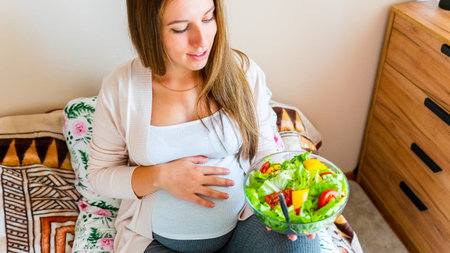 Pregnant healthy food diet. Pregnancy woman eating nutrition diet food salad. Healthy vegetarian food, healthy lifestyleの写真素材