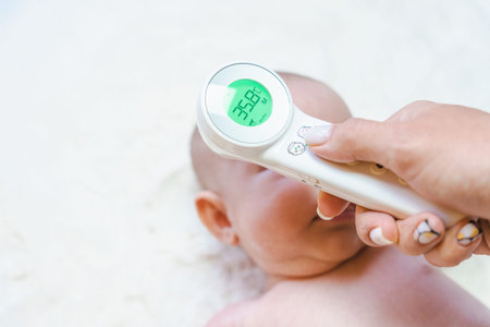 Electronic thermometer fever kid. Doctor check cold flu baby temperature care from electronic...