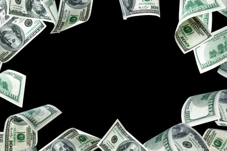 hundred dollar bill. Falling money isolated on black background. american cashの写真素材