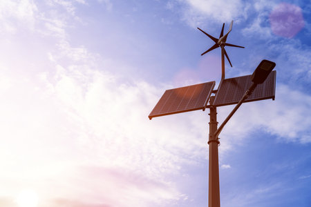 Wind turbines solar panels. Renewable photovoltaic technology with solar energy power panel and wind turbine. Solar energy panels power.の写真素材