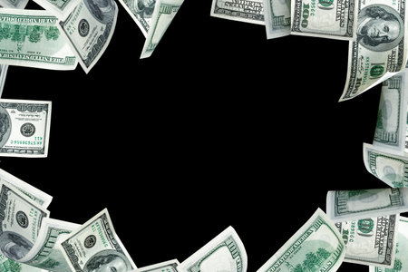 Hundred dollar bill. Falling money isolated on black background. American cash.の写真素材