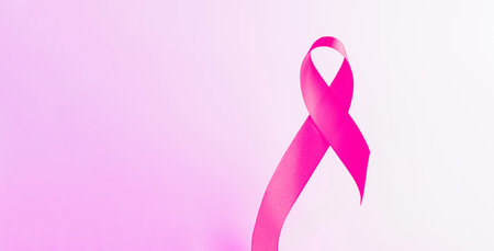 Cancer ribbon. Health care symbol pink ribbon on white background. Breast cancer woman support concept. World cancer day.の写真素材