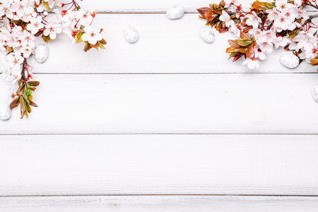 Easter egg background. May flowers, white happy easter egg on wooden spring background. Easter card. flat layの写真素材