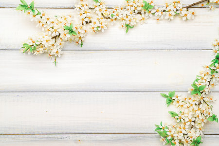 Spring background may flowers and April floral nature on wooden background. Branches of blossoming. Easter spring greeting cards with copy space. Springtime.の写真素材