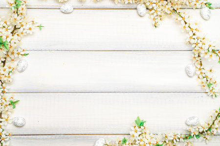 Easter eggs wood. April floral nature, white happy easter eggs on wood spring background. Easter pattern with place for text.の写真素材