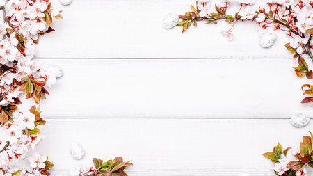 Easter eggs wood. April floral nature, white happy easter eggs on wood spring background. Easter pattern with place for text.の写真素材