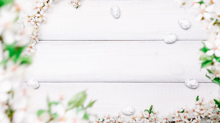 Easter eggs wood. April floral nature, white happy easter eggs on wood spring background. Easter pattern with place for text.の写真素材