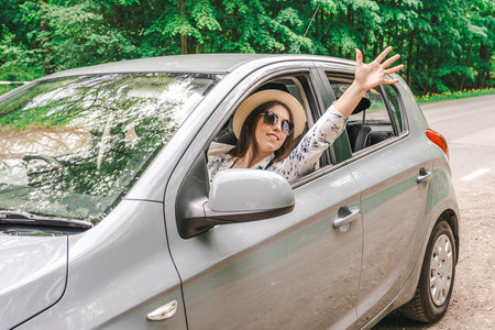 Travel couple. Man woman car journey. Love together smiling sunglassesの写真素材