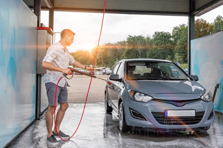 Car wash background. Car washing station foam. Man self service detail splashの写真素材