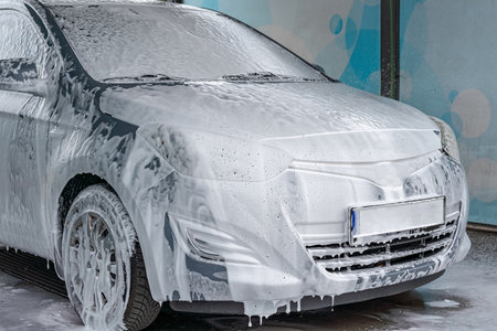 Car wash background. Car washing station foam. Man self service detail splashの写真素材