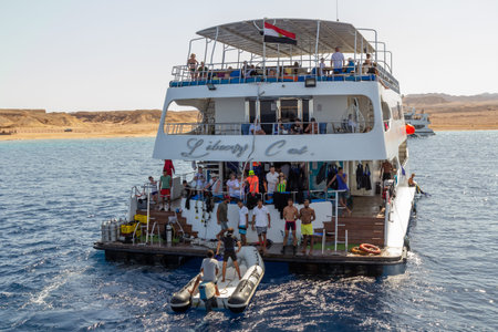SHARM EL SHEIKH, EGYPT - JUNE 7, 2021: Luxury yacht with tourists in a bay of the Red Sea in Sharm...