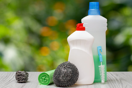 Plastic bottles of dishwashing liquid, detergent for microwave ovens and stoves, metal sponges and...