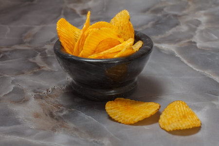 Potato chips in a stone bowl.