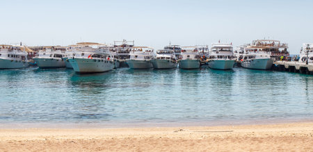 SHARM EL SHEIKH, EGYPT - JUNE 7, 2021: Luxury yachts with tourists on board in the bay of the Red Sea in Sharm El Sheikh in Egypt.のeditorial素材