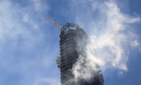 A building under construction with blue sky on backgroundの写真素材