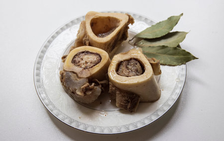 Brain beef bones ossobuco bay leaf and broth with garlic and pepper ready to eatの写真素材