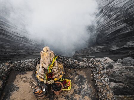 Hindu statue on the background of a volcano crater. A view from top of the Bromoの写真素材