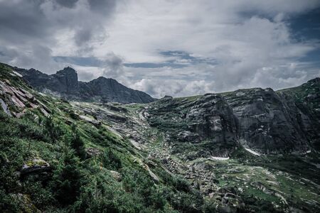 View of a mountain valley on a cloudy day, on top. Siberiaの写真素材